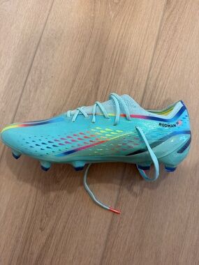 Trinity Rodman Soccer Cleat in Aqua with Rainbow Accents